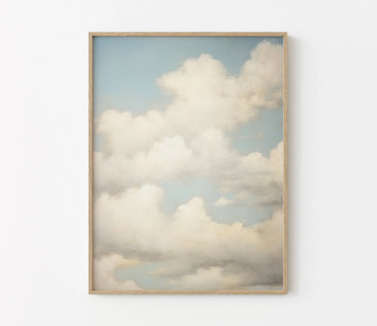 Framed artwork of clouds on a white wall