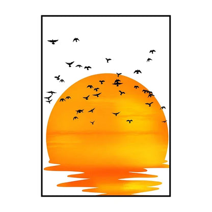 Framed artwork of an orange sunset with birds flying over water.