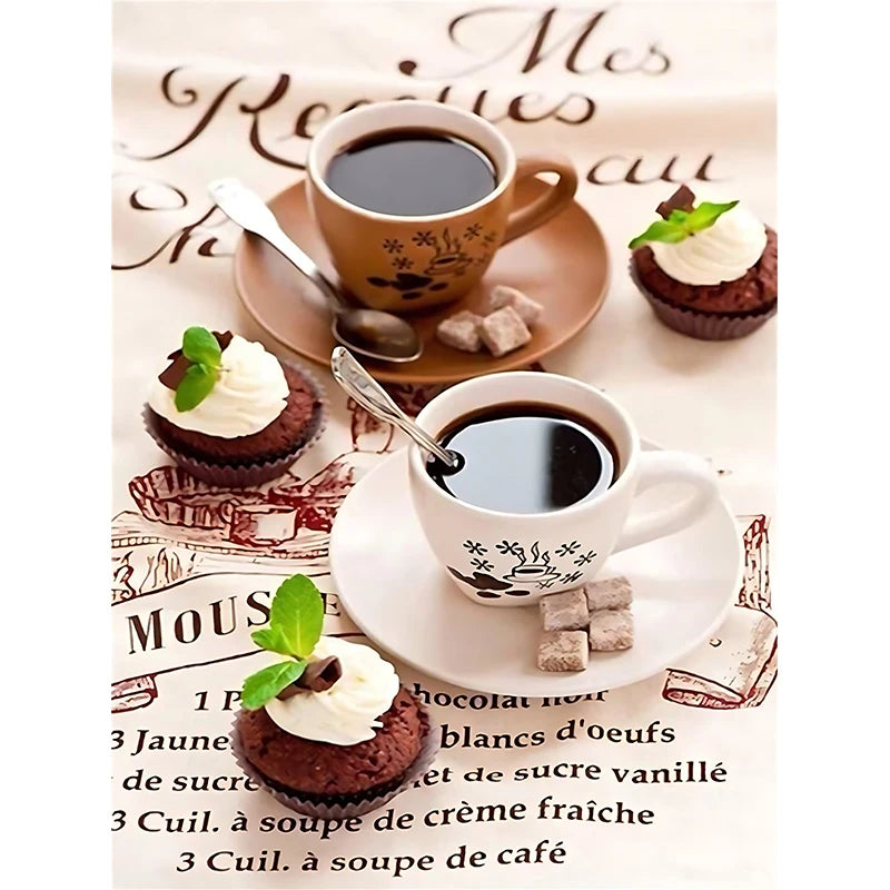 Two coffee cups with spoons and pastries on a decorative paper background