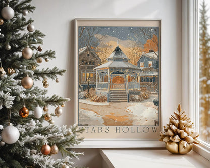 Framed artwork titled 'Hills Hollow' on a wall next to a decorated Christmas tree.