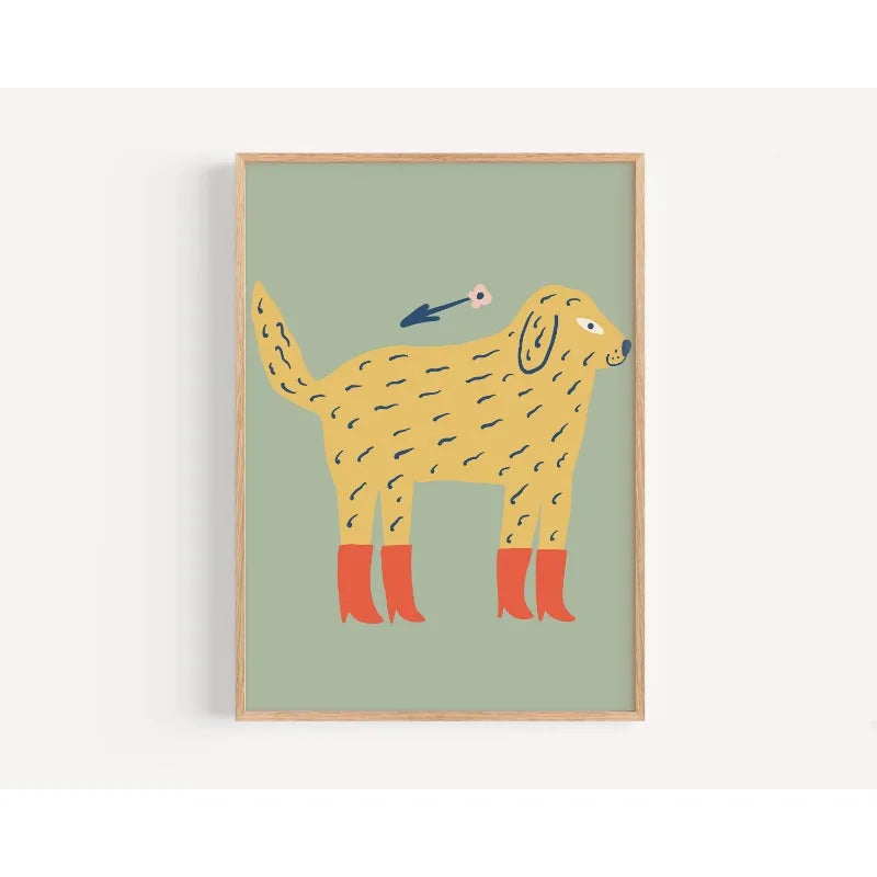 Framed illustration of a yellow dog with red shoes on a green background