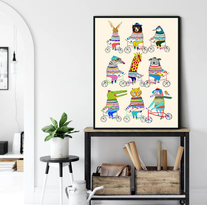 Framed colorful animal illustration on a wall above a shelf with books and plants.