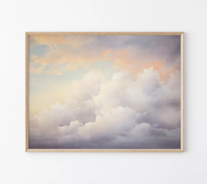 Framed artwork of a cloud scene with a wooden frame on a white wall