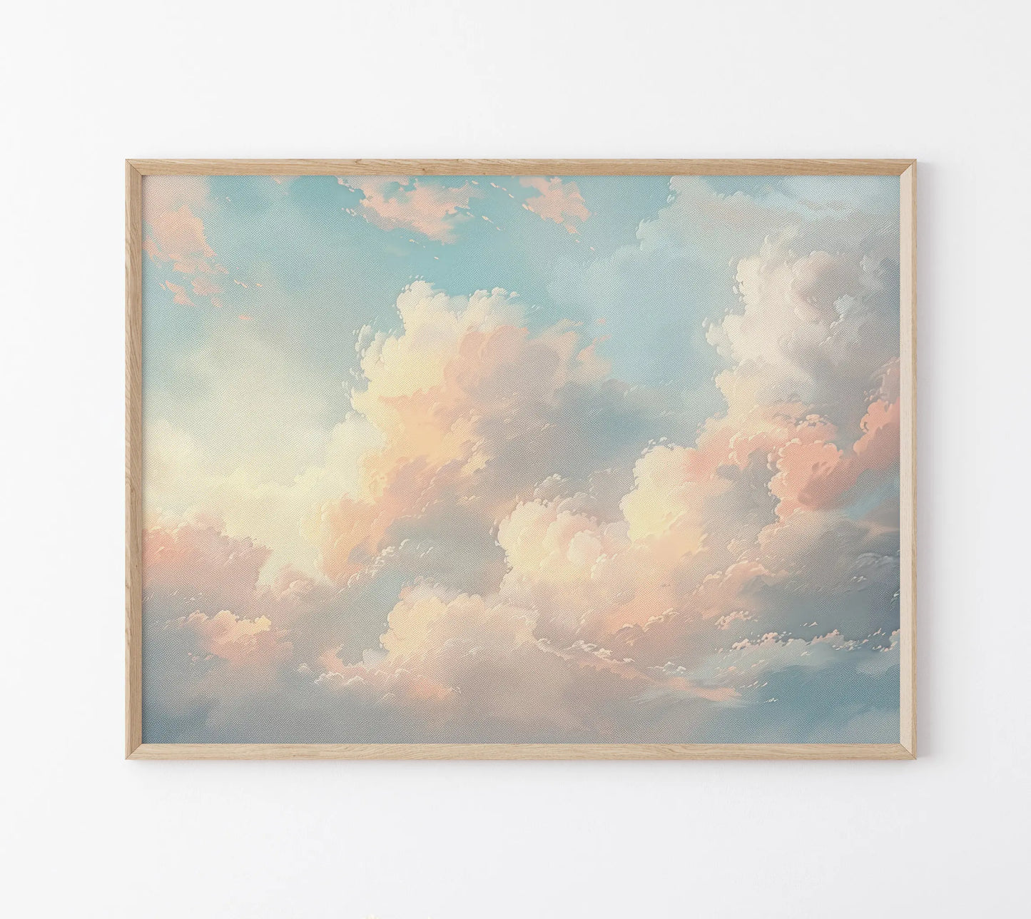 Framed artwork of a pastel sky with clouds on a white wall