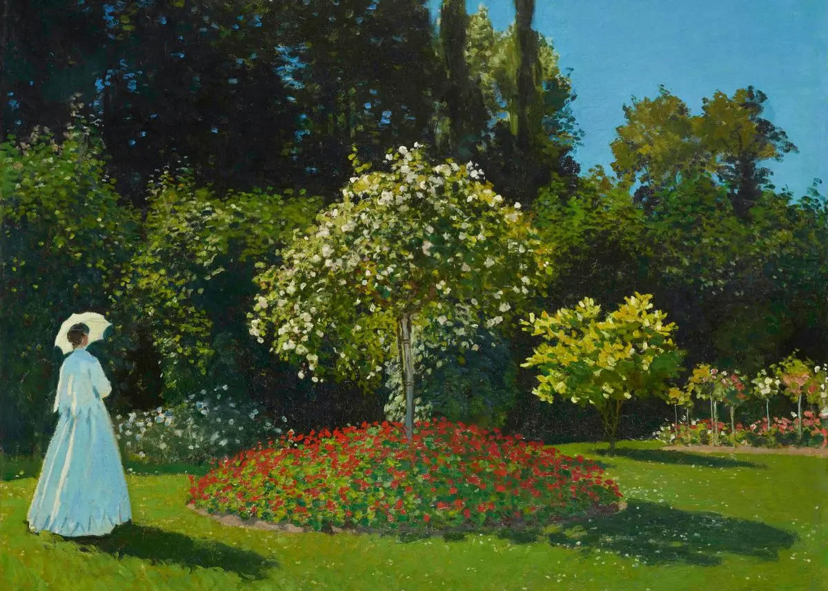 Woman in a garden with flowers and trees