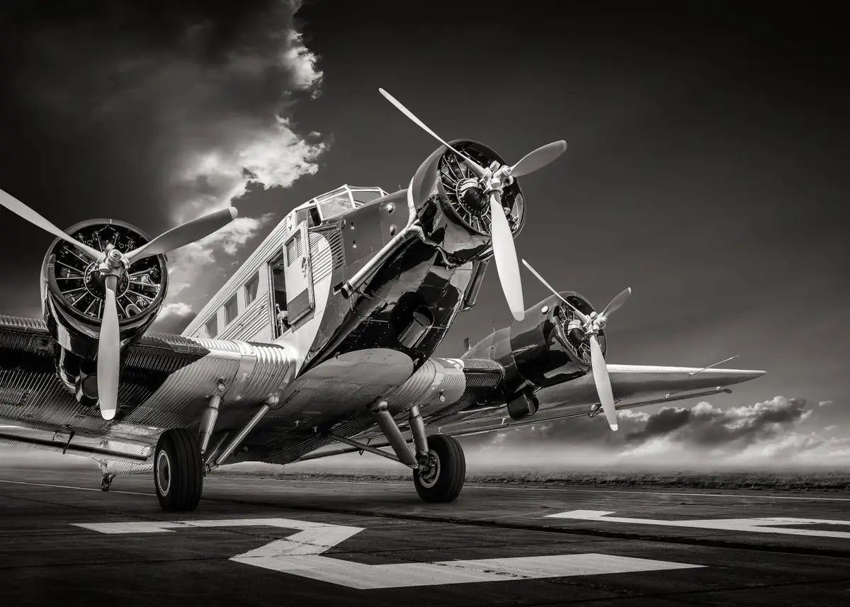Vintage airplane on a runway with dramatic sky