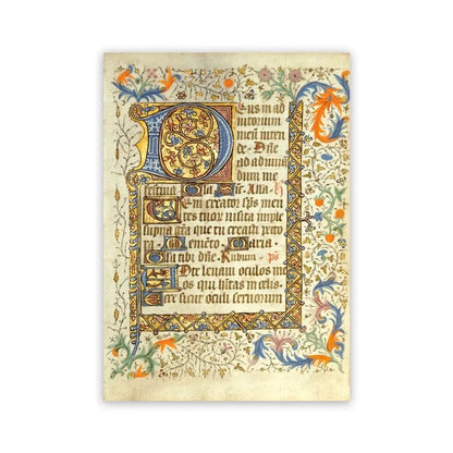 Decorative page from a book with intricate lettering and colorful borders on a white background