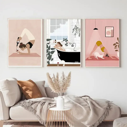 Three framed artworks on a wall above a sofa with decorative elements. Canvas & Curio