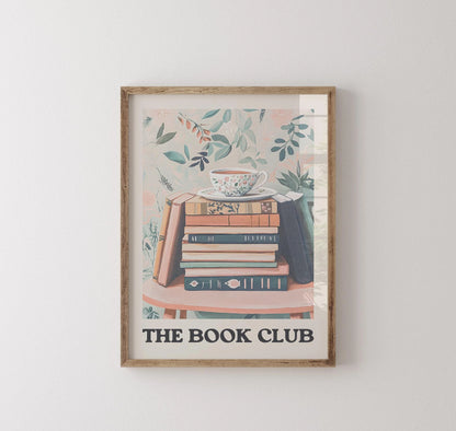 Framed artwork with 'The Book Club' text and book illustration on a white wall.