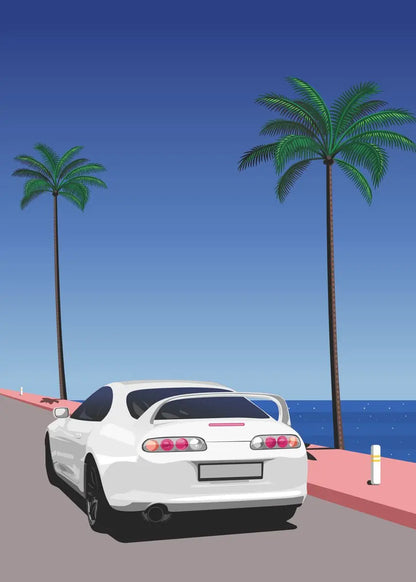 White car on a road with palm trees and ocean in the background