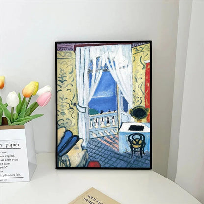 Framed artwork of a colorful scene with a woman and penguins on a balcony.