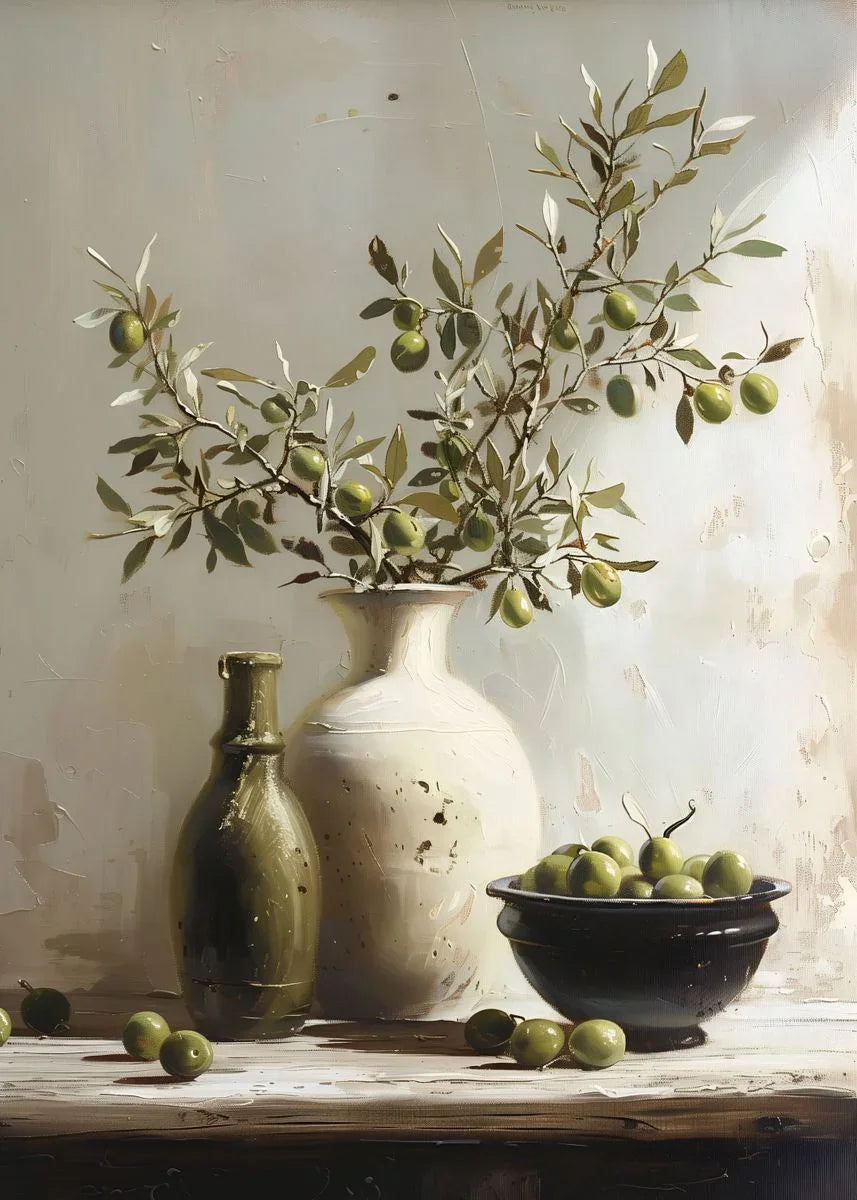 Still life arrangement with olive branches, bottles, and a bowl on a wooden surface.