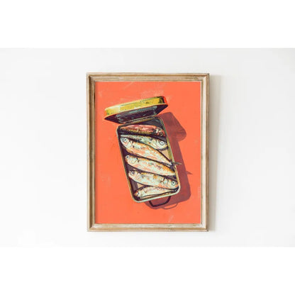 Framed artwork of a can of sardines on an orange background