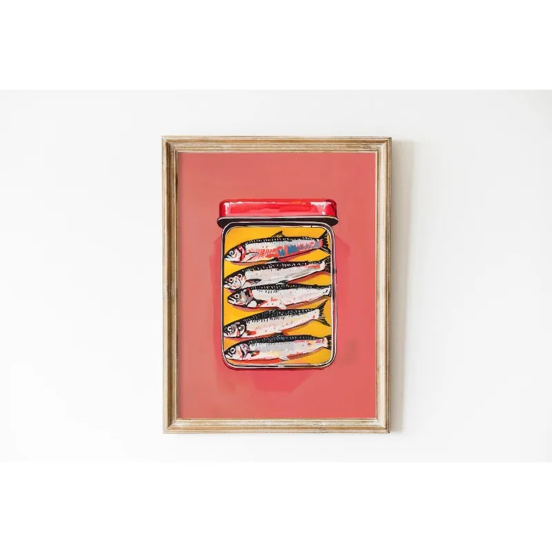 Framed artwork of a jar with fish on a red background