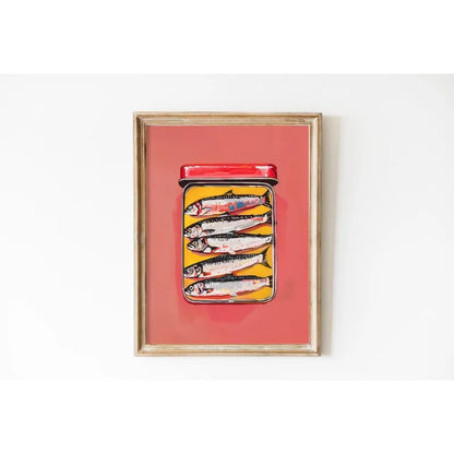 Framed artwork of a jar with fish on a red background