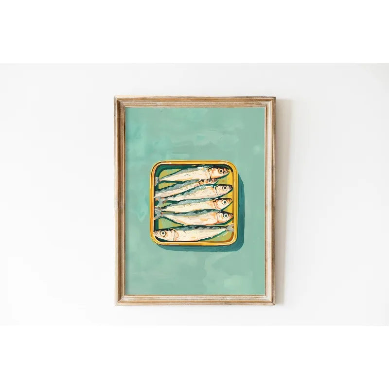 Framed artwork of a yellow tray with fish on a teal background