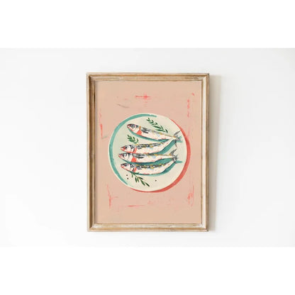 Framed artwork of fish on a white wall