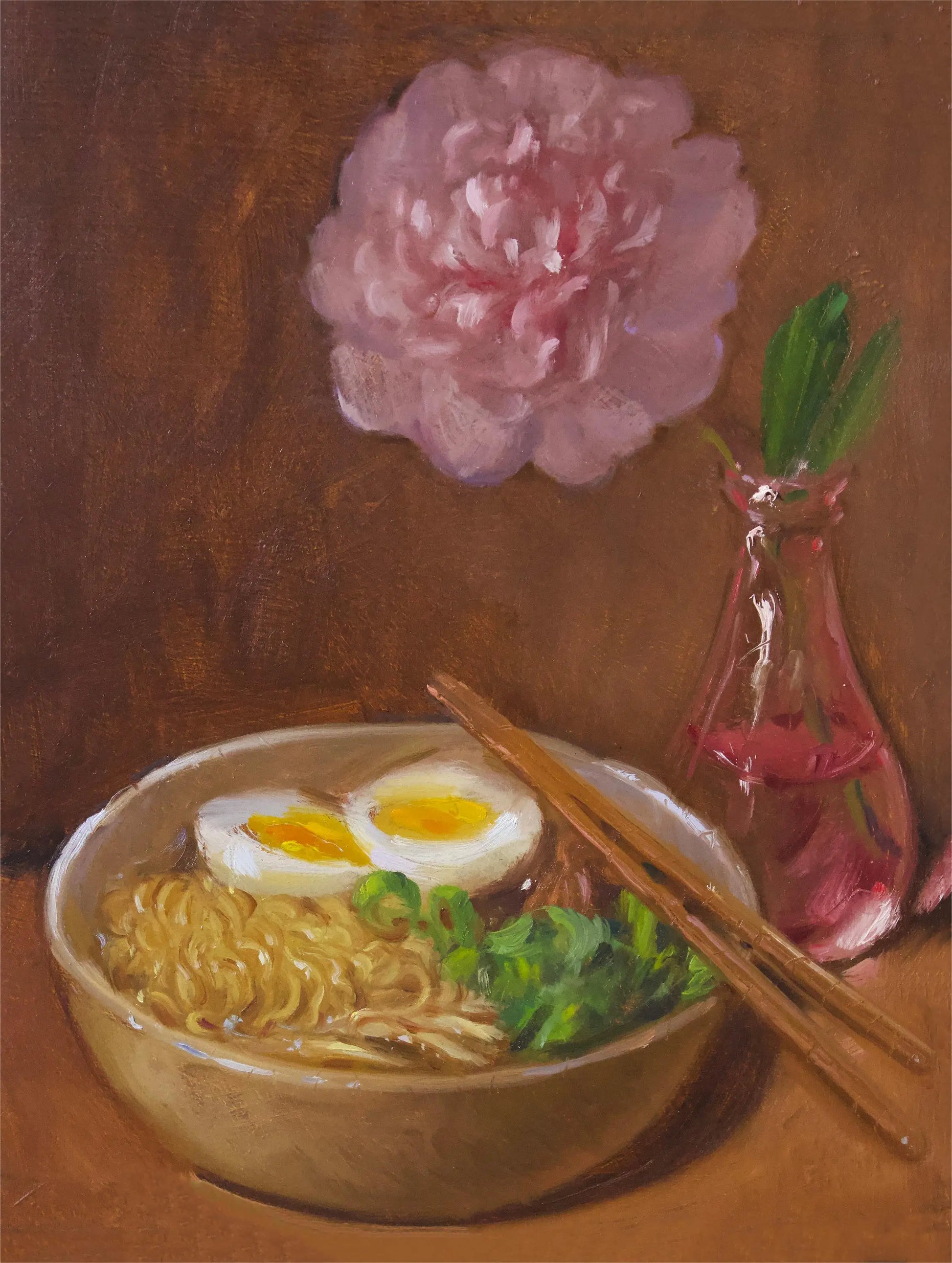 Bowl of ramen with a boiled egg, green onions, and chopsticks on a brown background with a pink flower.