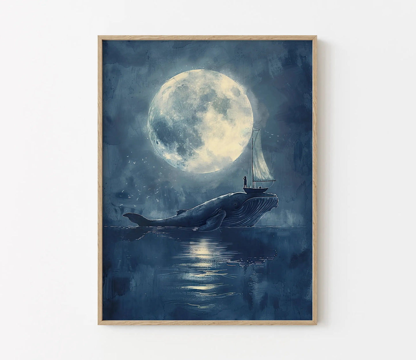 Framed artwork of a whale with a sailboat under a large moon on a blue background.