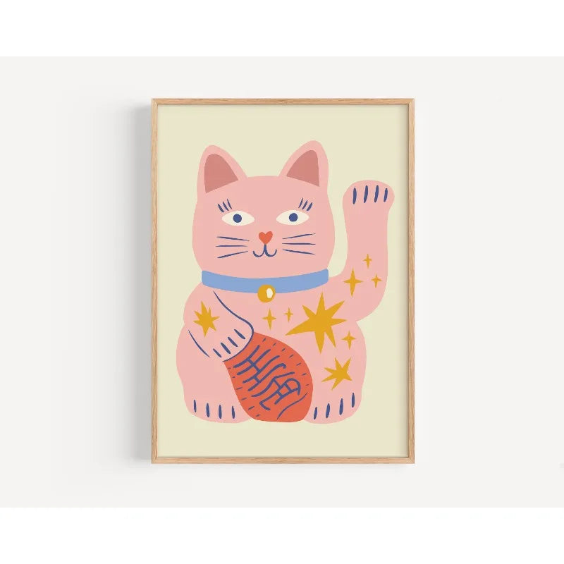 Framed artwork of a pink cat with stars on a light background