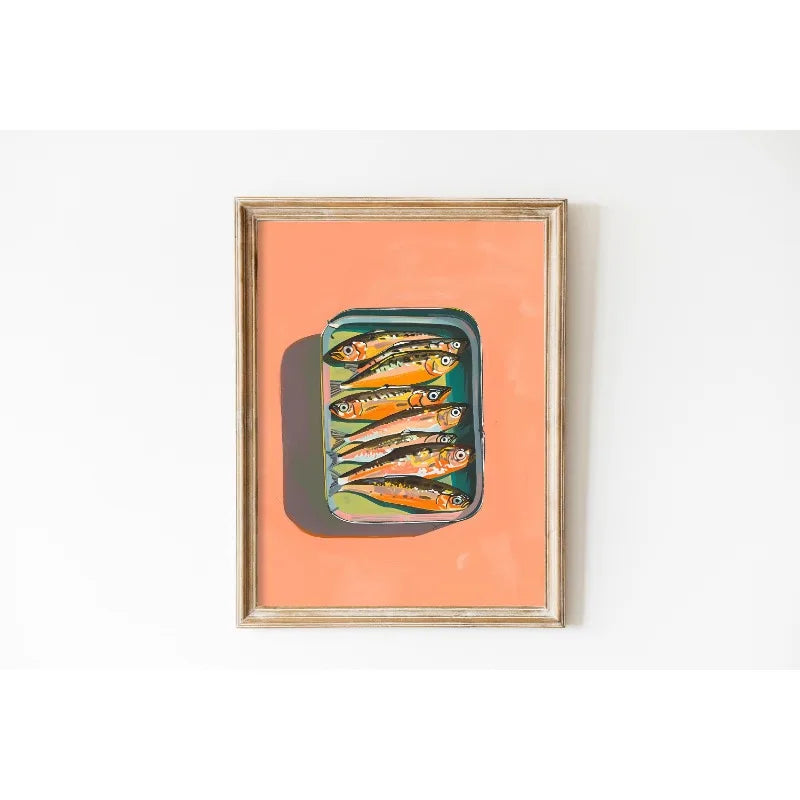 Framed artwork of a can with fish on a peach background