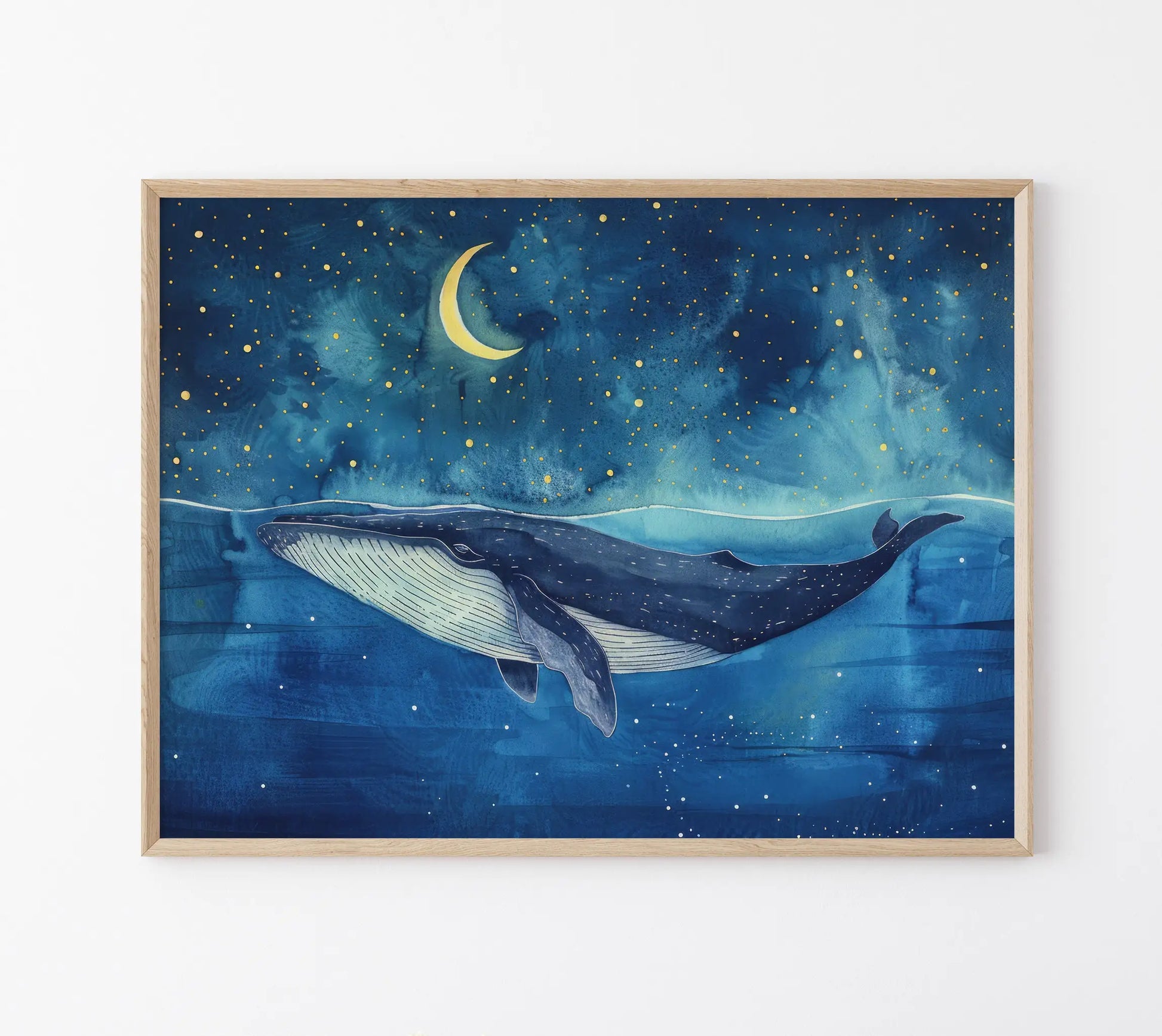 Framed artwork of a whale swimming under a starry night sky with a crescent moon.