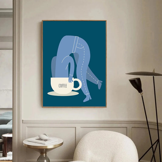 Framed artwork of a person leaning over a coffee cup on a wall in a modern living room. Canvas & Curio