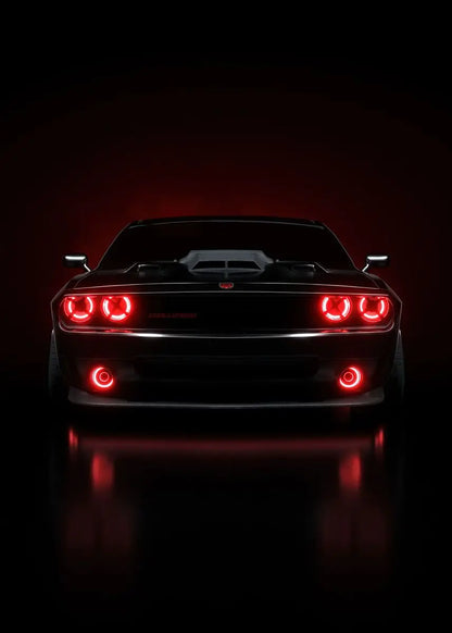 Black car with red taillights on a dark background