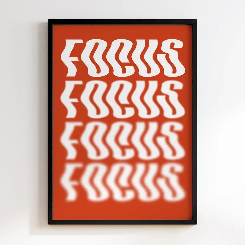 Framed poster with 'FOCUS' text on a red background