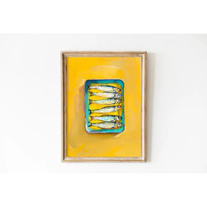 Framed artwork of a blue container with fish on a yellow background