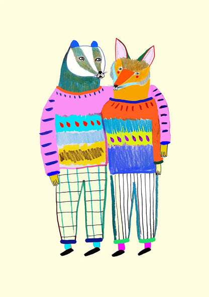 Two animals, a badger and a fox, wearing colorful sweaters and pants on a beige background.
