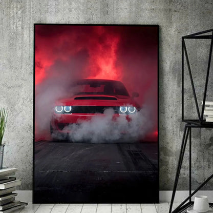 Framed poster of a red car with smoke effects on a concrete wall.