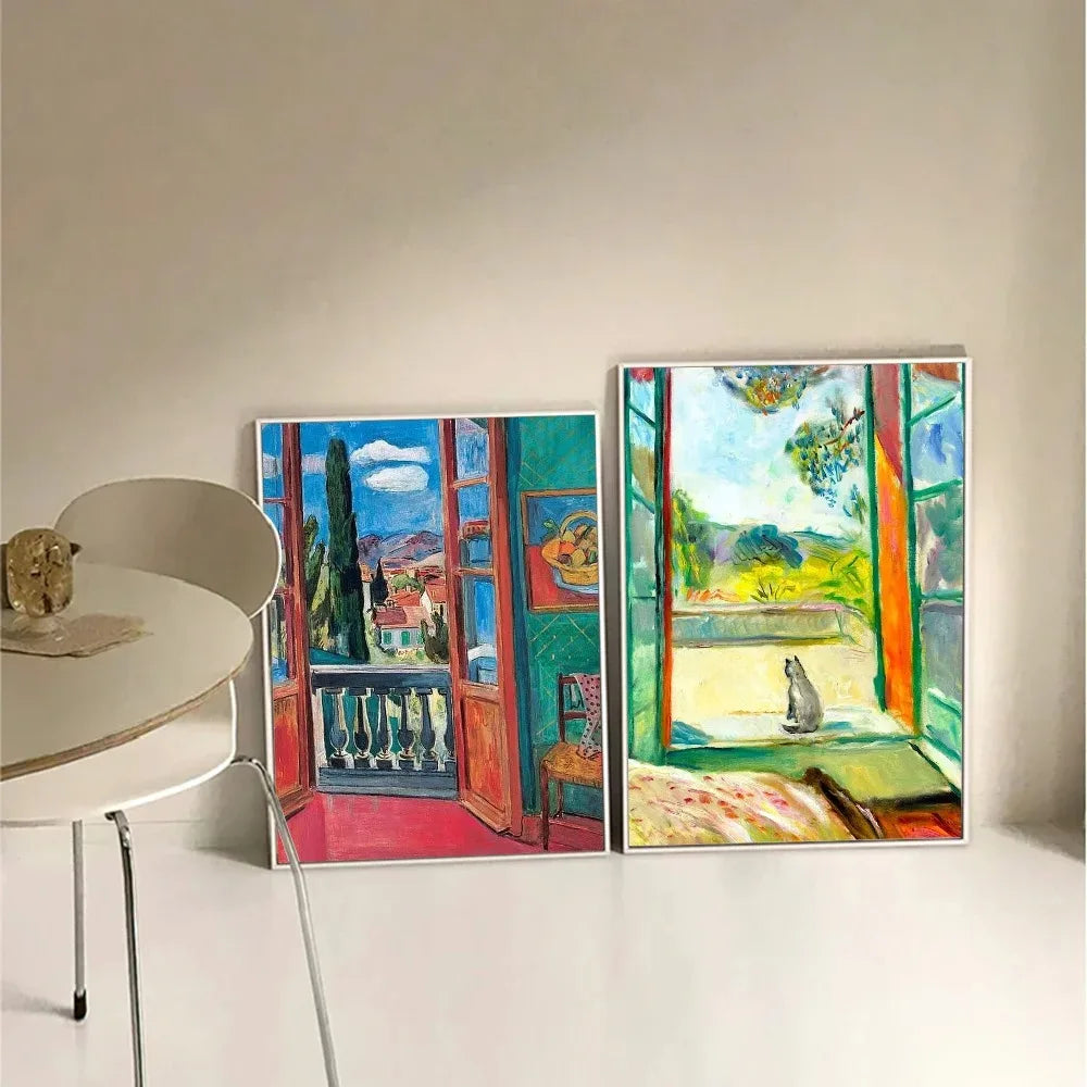 Two colorful artworks of open windows with views of landscapes on a white wall.