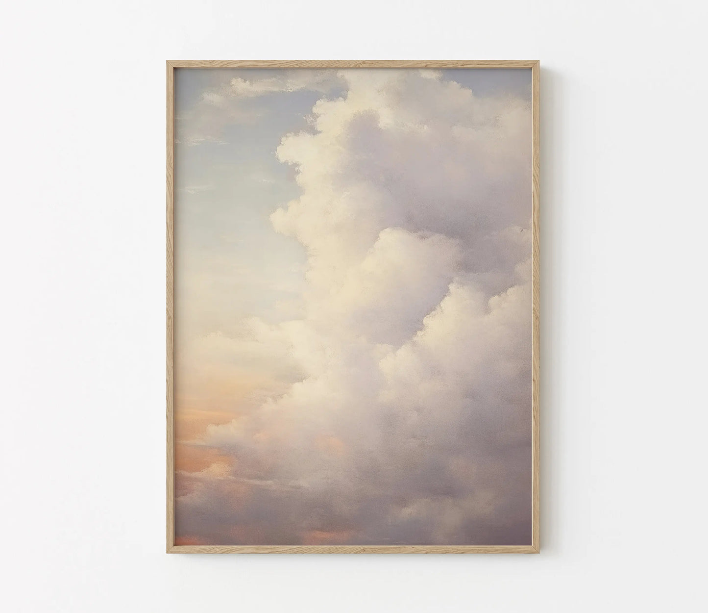 Framed artwork of a cloud with a wooden frame on a white wall