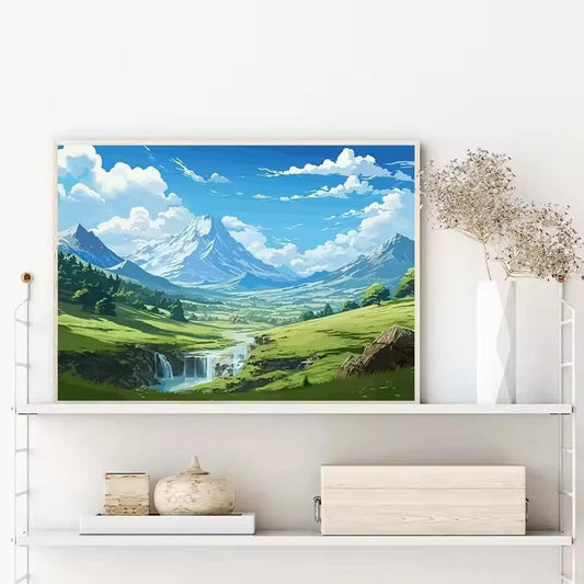 Framed artwork of a mountain landscape with a waterfall on a white wall. Canvas & Curio