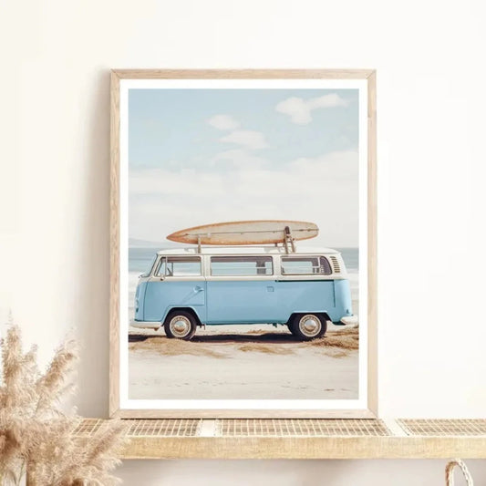 Framed artwork of a vintage van with a surfboard on a beach Canvas & Curio