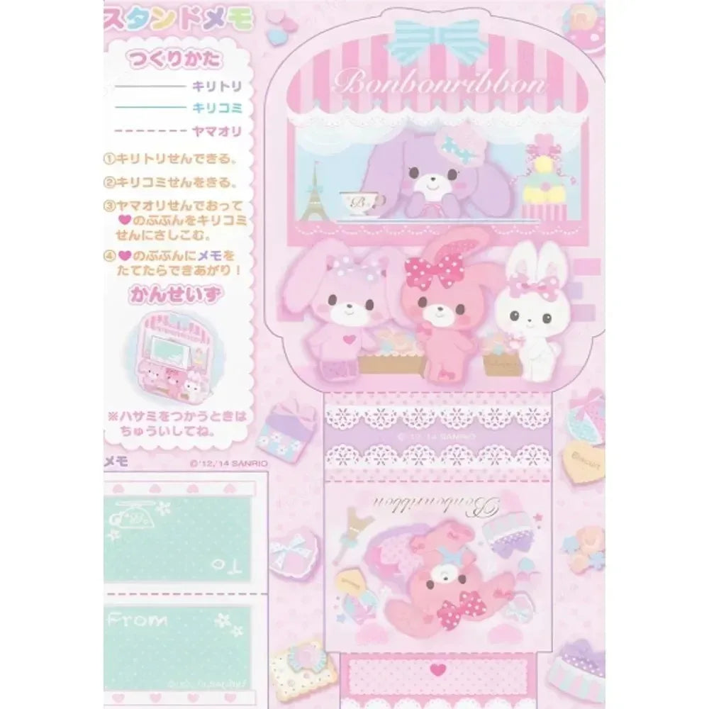 Kawaii-themed stationery set with cartoon characters on a pink background