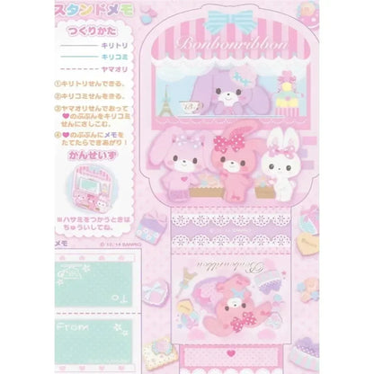 Kawaii-themed stationery set with cartoon characters on a pink background