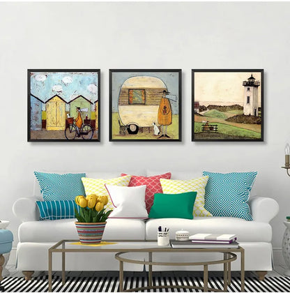 Living room with a white sofa, colorful pillows, and three framed artworks on the wall.