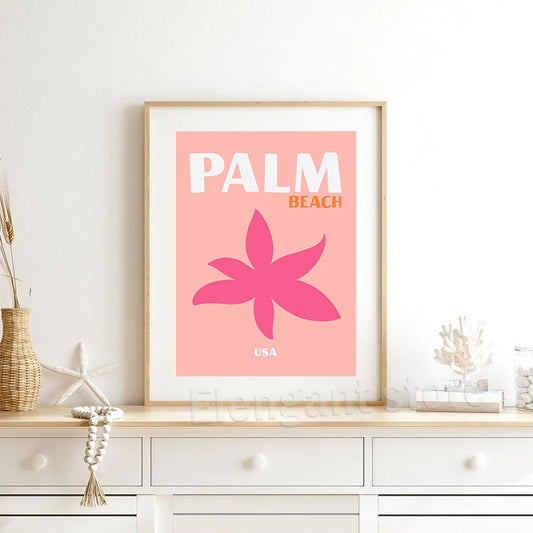 Framed artwork with 'Palm Beach USA' design on a wall above a white cabinet. Canvas & Curio