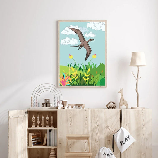 Framed children's illustration of a pterodactyl flying over a grassy field with flowers on a wall above a wooden cabinet. Canvas & Curio