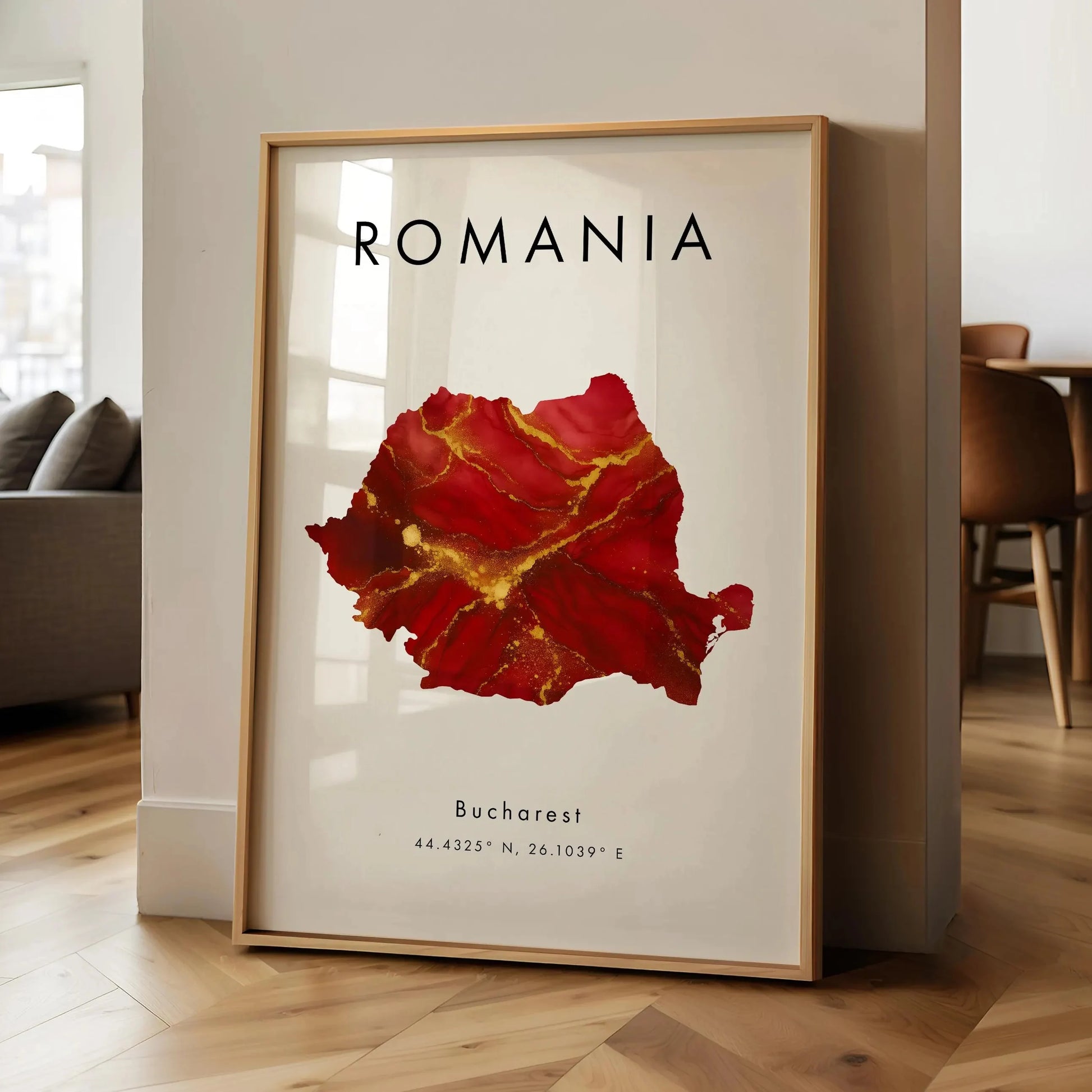 Framed map of Romania with red and gold design in a living room setting