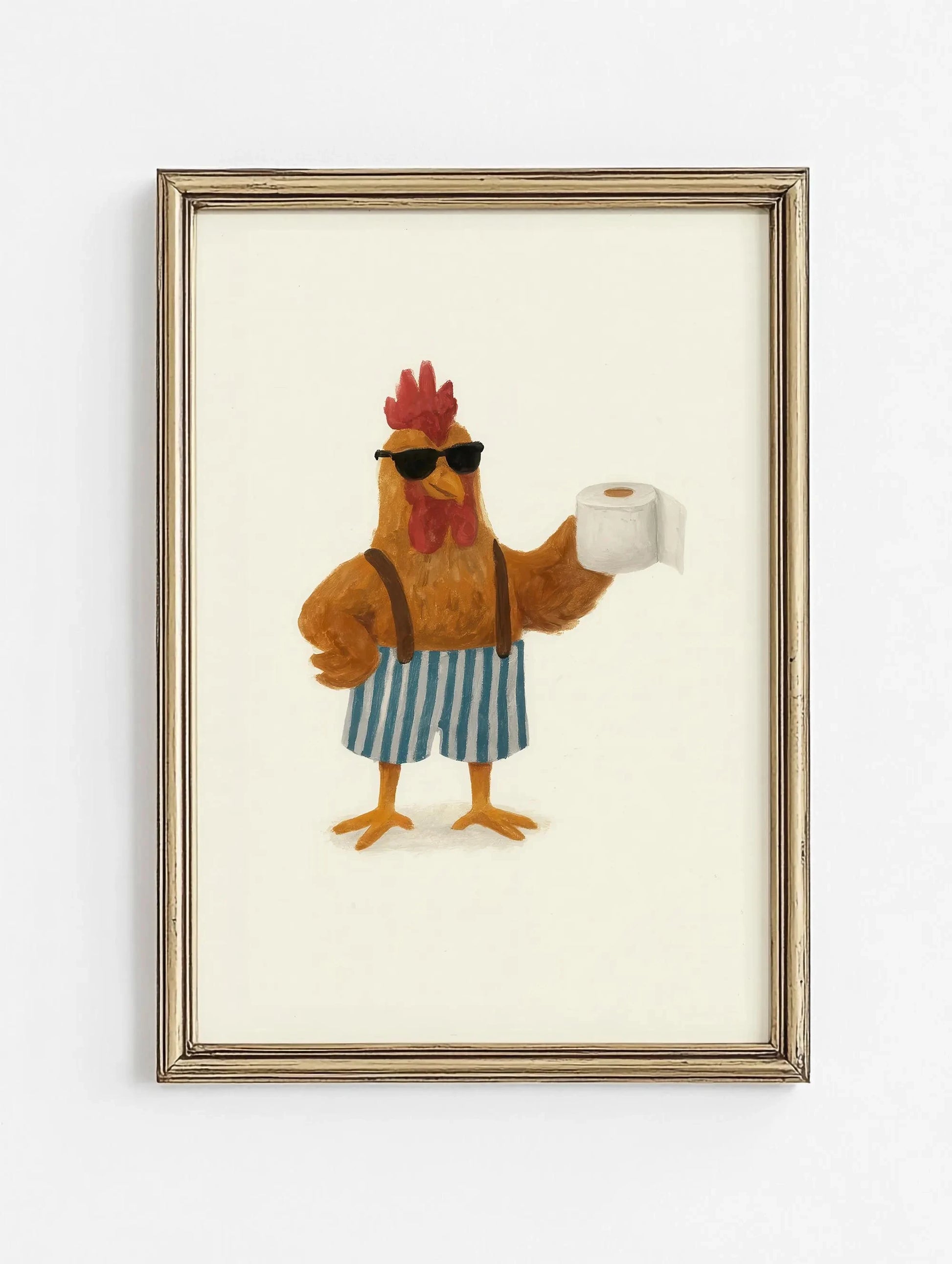 Framed artwork of a rooster holding a roll of toilet paper on a white background