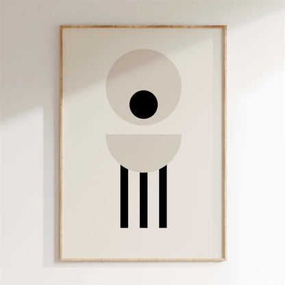 Framed abstract art print with geometric shapes on a plain wall