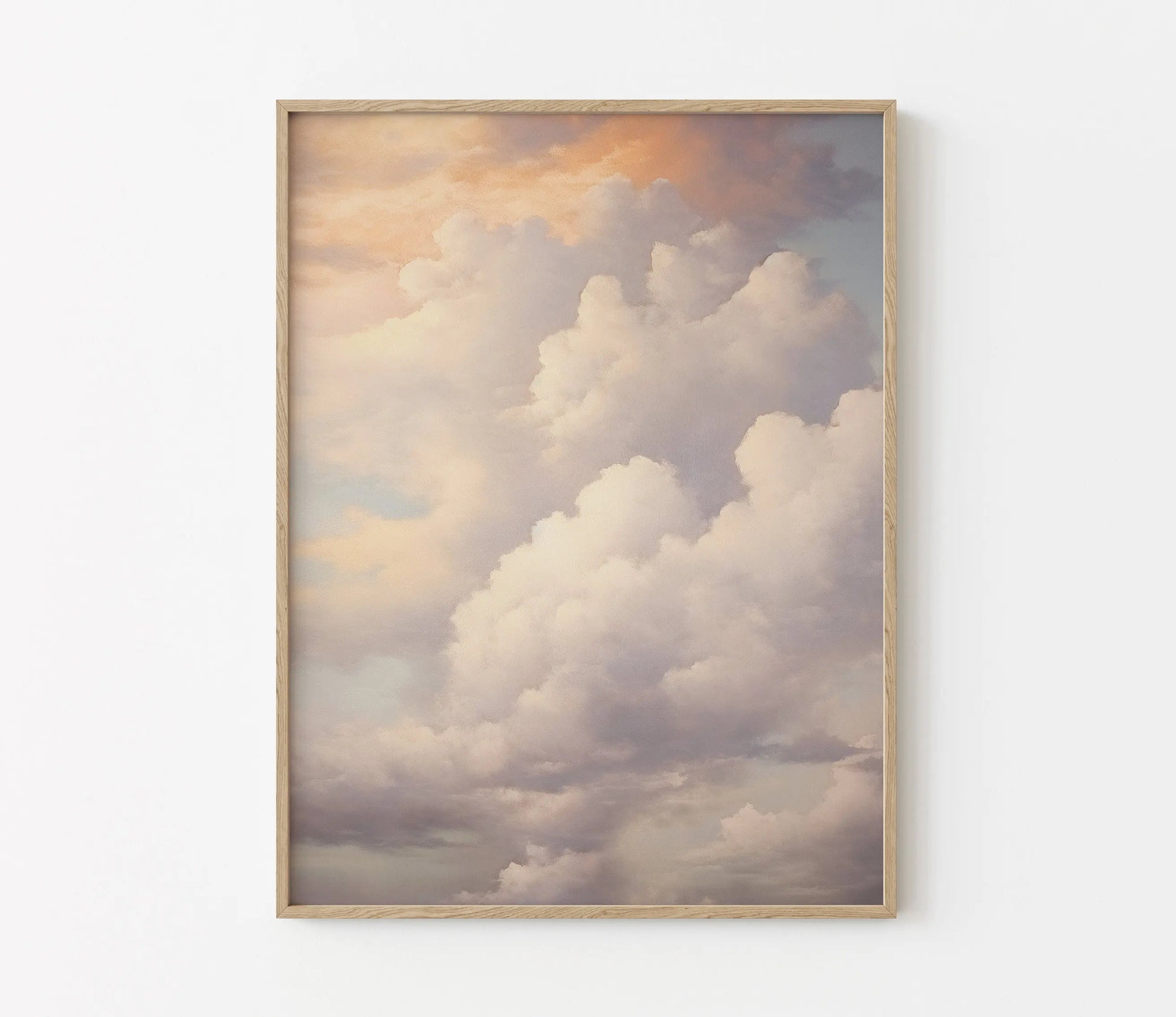 Framed artwork of a cloud scene on a white wall
