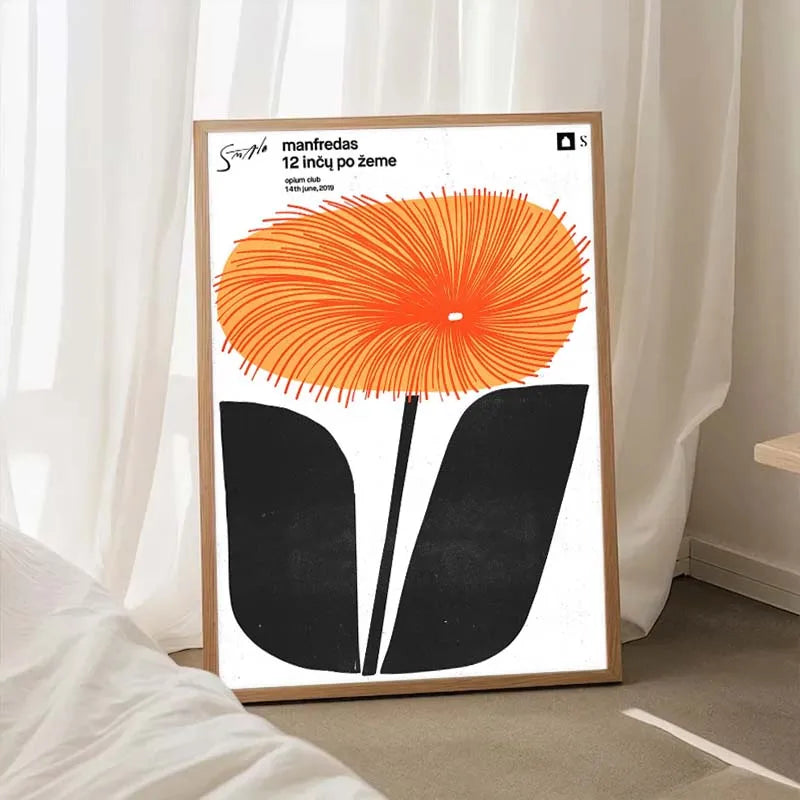 Framed poster with an orange and black flower design on a white background