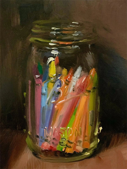 Jar filled with colorful plastic items on a wooden surface