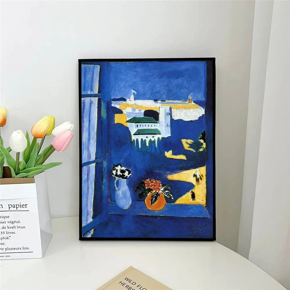 Framed artwork with a blue background and colorful objects on a white surface.