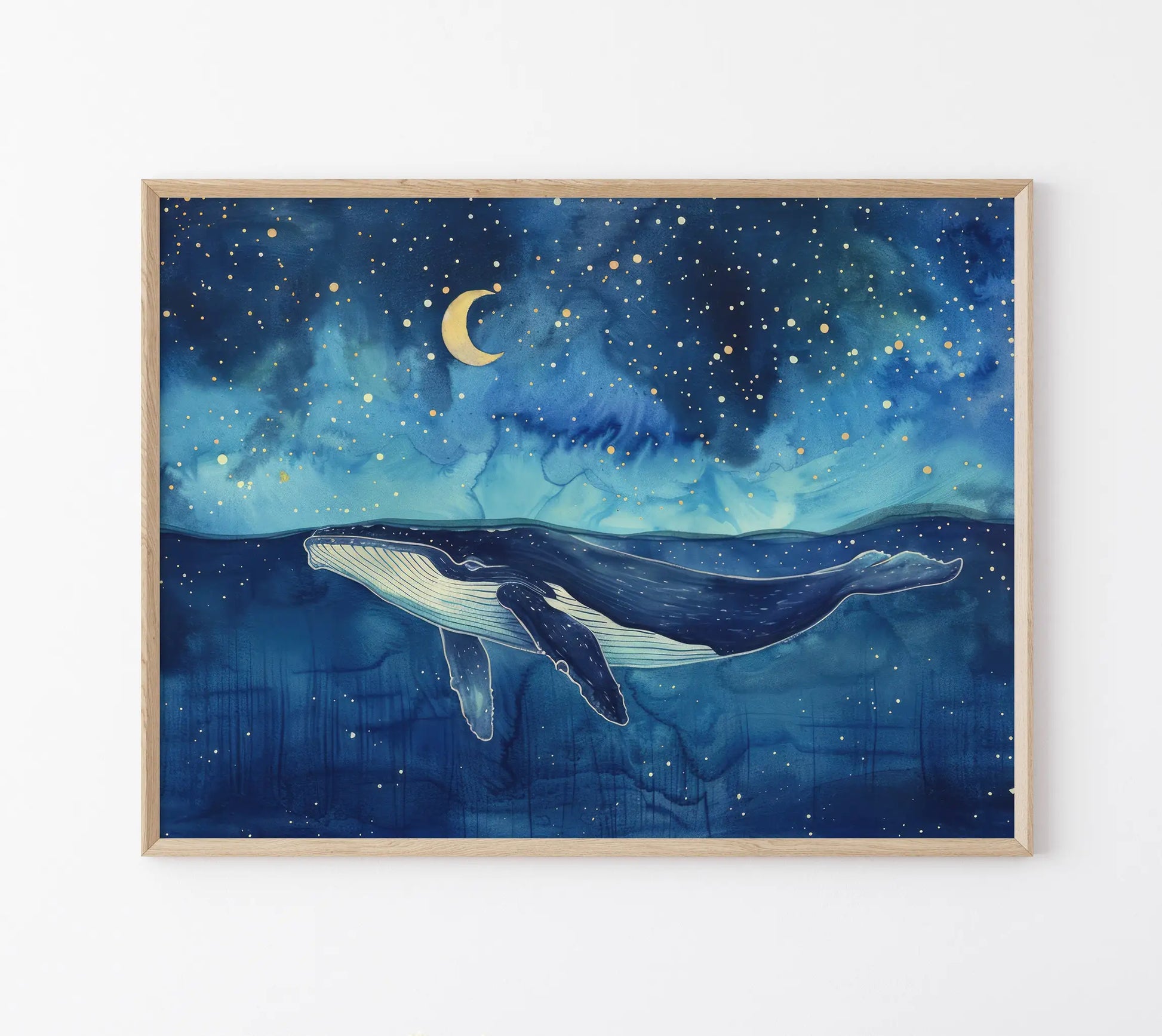Framed artwork of a whale swimming under a starry night sky with a crescent moon.