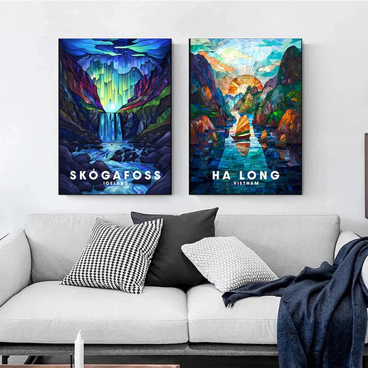 Two colorful wall art prints of Skögafoss and Ha Long Bay above a sofa with decorative pillows. Canvas & Curio